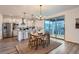 Dining room adjacent to kitchen features an outdoor view through a large sliding glass door at 26902 E Ellsworth Ave, Aurora, CO 80018