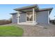 Back of house exterior with covered patio and landscaped yard at 26902 E Ellsworth Ave, Aurora, CO 80018