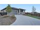 Contemporary home with a long driveway and well-maintained landscaping at 26902 E Ellsworth Ave, Aurora, CO 80018