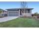 Charming home featuring a manicured front yard and a two-car garage at 26902 E Ellsworth Ave, Aurora, CO 80018