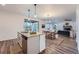 Kitchen with island open to dining and living areas at 26902 E Ellsworth Ave, Aurora, CO 80018