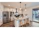 Modern kitchen with stainless steel appliances and island seating at 26902 E Ellsworth Ave, Aurora, CO 80018