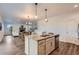 Open kitchen with granite island and stainless steel appliances at 26902 E Ellsworth Ave, Aurora, CO 80018