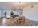 Open concept living and dining area with fireplace and ceiling fan at 26902 E Ellsworth Ave, Aurora, CO 80018