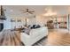 Open-concept living area with modern decor and seamless flow to dining at 26902 E Ellsworth Ave, Aurora, CO 80018