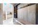 View of a spacious mudroom with a built-in bench, storage shelves, and decorative hooks at 4808 Point Mesa St, Castle Rock, CO 80108