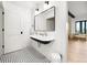 Classic bathroom with black and white tile flooring and vintage sink at 534 W Meadow Rd, Evergreen, CO 80439