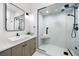 Modern bathroom with a glass-enclosed shower, sleek vanity, and contemporary fixtures at 534 W Meadow Rd, Evergreen, CO 80439