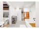 Well-organized bathroom with changing station, a bathtub, and built in closet space at 534 W Meadow Rd, Evergreen, CO 80439