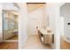Modern bathroom featuring a walk-in shower, sleek vanity with plenty of counter space, and stylish fixtures at 534 W Meadow Rd, Evergreen, CO 80439