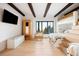 Bright bedroom with wooden beams, bunk beds, storage, desk, and large windows with scenic views at 534 W Meadow Rd, Evergreen, CO 80439