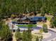 Stunning exterior of an estate featuring stone accents, multiple balconies, and a long winding driveway at 534 W Meadow Rd, Evergreen, CO 80439
