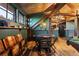 Finished attic space with a game table, seating, and unique architectural details at 534 W Meadow Rd, Evergreen, CO 80439