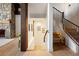 A hallway featuring access to the basement and stairs to the upper floors at 534 W Meadow Rd, Evergreen, CO 80439