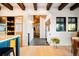 View of kitchen and hallway with wood floors and natural light from windows at 534 W Meadow Rd, Evergreen, CO 80439