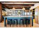 Spacious kitchen with a large island, stainless steel appliances, and rustic wood beam accents at 534 W Meadow Rd, Evergreen, CO 80439