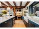 Open floor plan kitchen featuring island, marble counters and stainless steel stove at 534 W Meadow Rd, Evergreen, CO 80439