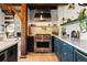 A kitchen featuring stainless steel stove and a granite countertop with light wood floors at 534 W Meadow Rd, Evergreen, CO 80439