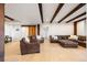Spacious living room with hardwood floors and exposed wood beams at 534 W Meadow Rd, Evergreen, CO 80439