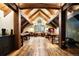 Bright home office with hardwood floors, wood beams, and natural light at 534 W Meadow Rd, Evergreen, CO 80439