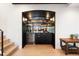 Modern wet bar featuring a wine fridge, shelving, and ample counter space at 534 W Meadow Rd, Evergreen, CO 80439
