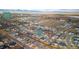 Expansive aerial view of a vibrant neighborhood with modern homes, set against a backdrop of scenic landscapes at 605 Wild Honey Dr, Berthoud, CO 80513