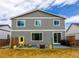 Large backyard with patio, fire pit, and ample space for outdoor activities at 605 Wild Honey Dr, Berthoud, CO 80513
