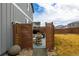 Inviting backyard patio area with privacy fencing and a low-maintenance yard at 605 Wild Honey Dr, Berthoud, CO 80513