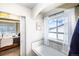 Bathroom showcases a soaking tub with a view and access to the bedroom via sliding door at 605 Wild Honey Dr, Berthoud, CO 80513