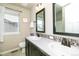 Bathroom features a double sink vanity, decorative backsplash and natural light at 605 Wild Honey Dr, Berthoud, CO 80513
