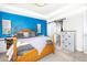 This bedroom has a king bed, carpet, sliding door and dresser at 605 Wild Honey Dr, Berthoud, CO 80513