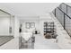 Spacious basement with an open floor plan, carpet, and modern staircase design at 1665 S Fillmore St, Denver, CO 80210