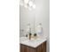 Stylish bathroom boasts a modern vanity, brushed gold fixtures, and sleek lighting at 1665 S Fillmore St, Denver, CO 80210