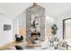 Bright living room with stone fireplace, large windows, hardwood floors, and stylish furniture at 1665 S Fillmore St, Denver, CO 80210