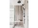 Spa-like shower with marble tile, built in bench, and modern fixtures at 1665 S Fillmore St, Denver, CO 80210