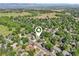 Overhead view of home in a serene neighborhood surrounded by lush trees, offering a tranquil and private setting at 215 Sunland St, Louisville, CO 80027