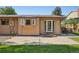 Enjoy the backyard from this patio space with easy access via French doors for relaxation and outdoor dining at 215 Sunland St, Louisville, CO 80027