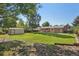 A spacious, grassy backyard is perfect for outdoor activities and relaxation with a storage shed at 215 Sunland St, Louisville, CO 80027