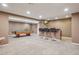 Finished basement with a pool table and a bar with seating for entertaining guests at 215 Sunland St, Louisville, CO 80027