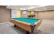 Basement rec room featuring a wooden pool table and a bar area at 215 Sunland St, Louisville, CO 80027