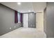 Carpeted basement area with a window and two white doors at 215 Sunland St, Louisville, CO 80027
