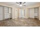 Bedroom with light walls, wood-look flooring, and abundant closet space at 215 Sunland St, Louisville, CO 80027