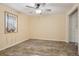 Bright bedroom with light walls, wood-look floors, a window, and a ceiling fan at 215 Sunland St, Louisville, CO 80027