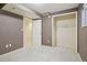 Bedroom features neutral walls and plush carpeting, adjoining room and ample closet space with shelving at 215 Sunland St, Louisville, CO 80027