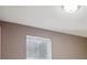 Neutral toned bedroom with a bright window and a flush mount ceiling light at 215 Sunland St, Louisville, CO 80027