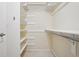 Walk in closet featuring shelves and carpeted floors at 215 Sunland St, Louisville, CO 80027