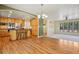 Open-concept living and dining area with hardwood floors and a view of the kitchen at 215 Sunland St, Louisville, CO 80027