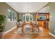 Elegant dining room featuring hardwood floors and direct access to the kitchen and back yard at 215 Sunland St, Louisville, CO 80027