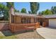 View of house featuring a cozy deck with an awning for shade at 215 Sunland St, Louisville, CO 80027