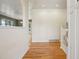 Bright foyer with hardwood floors and a view into adjacent living spaces at 215 Sunland St, Louisville, CO 80027